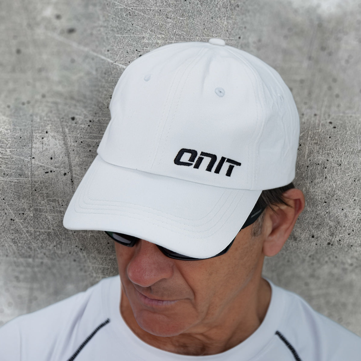 ONIT Black on White MTB cap with logo, worn by model