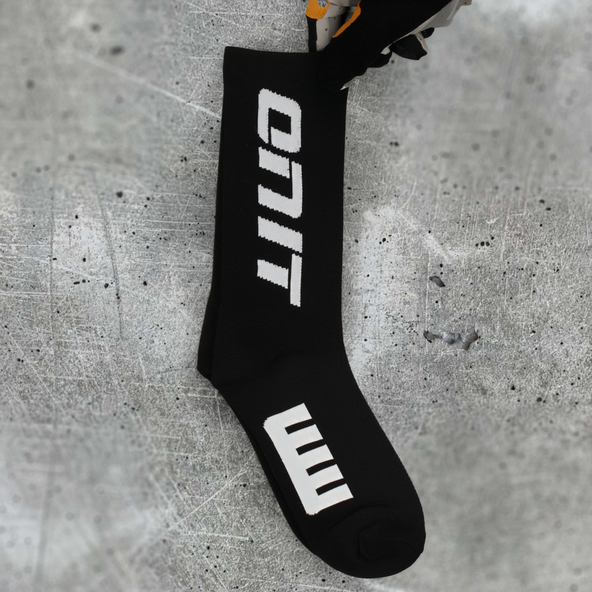 ONIT Black compression MTB socks, worn on foot