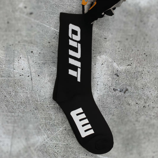 ONIT Black compression MTB socks, worn on foot