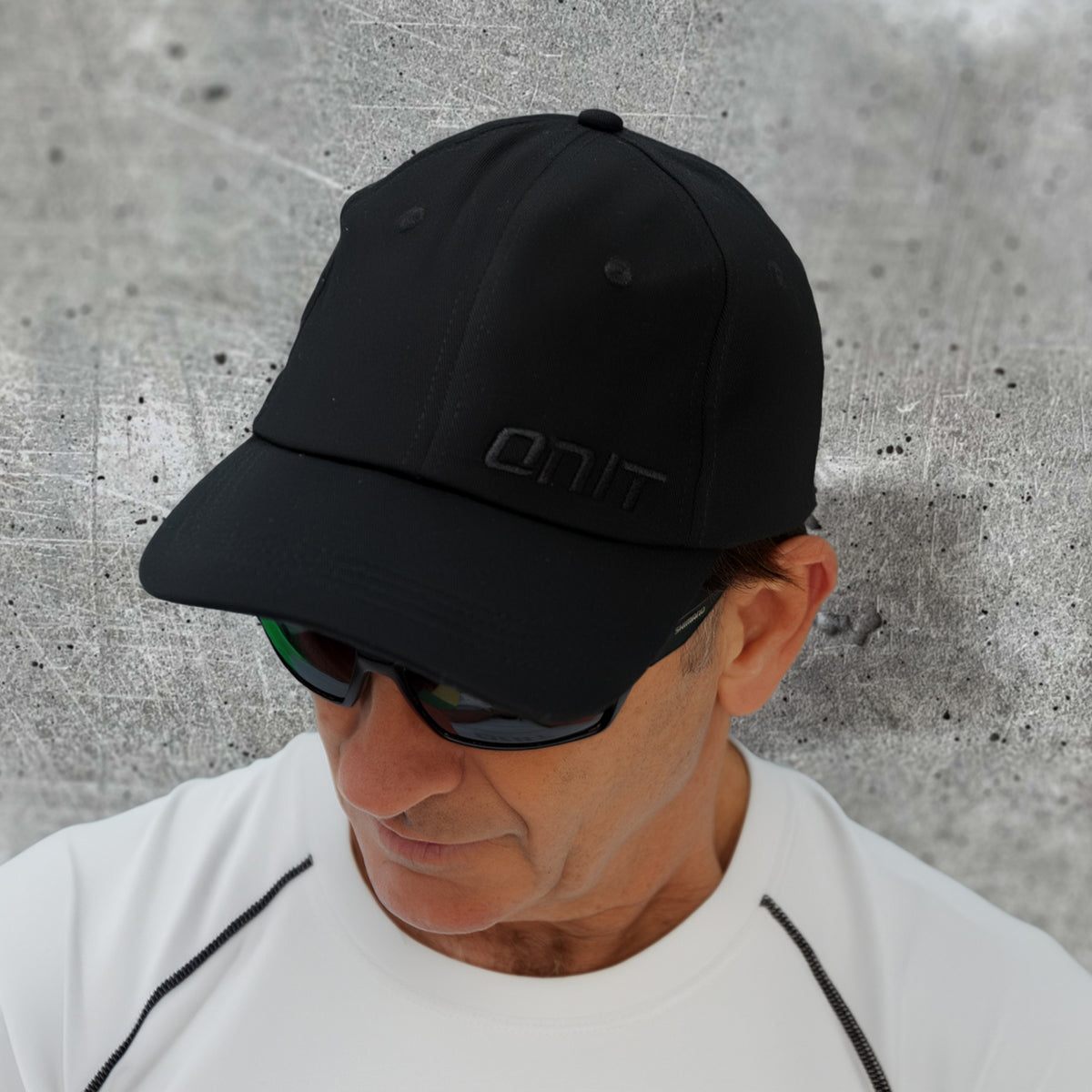 ONIT Black on Black MTB cap with logo, worn by model