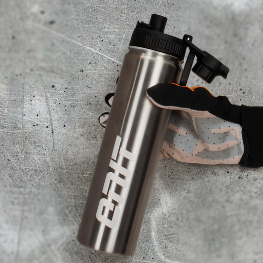 ONIT Chrome MTB water bottle, held in hand