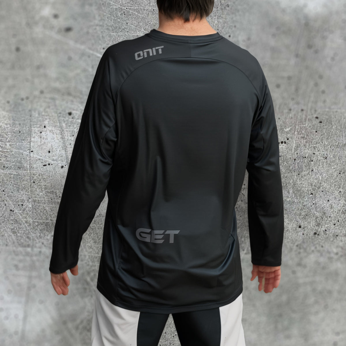 ONIT Black MTB jersey with white smiley graphic, long sleeve, back view