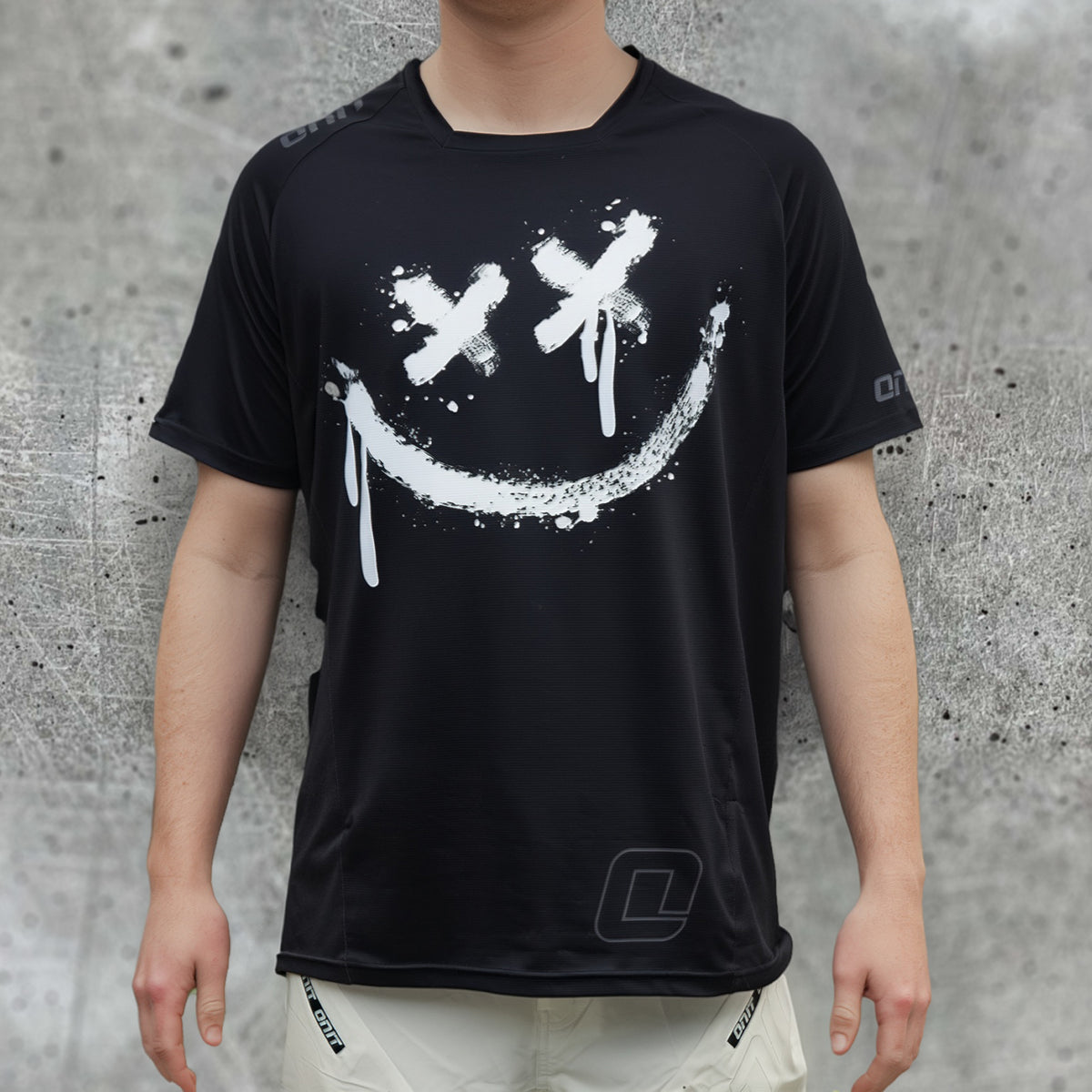 ONIT Black MTB jersey with white smiley graphic, short sleeve
