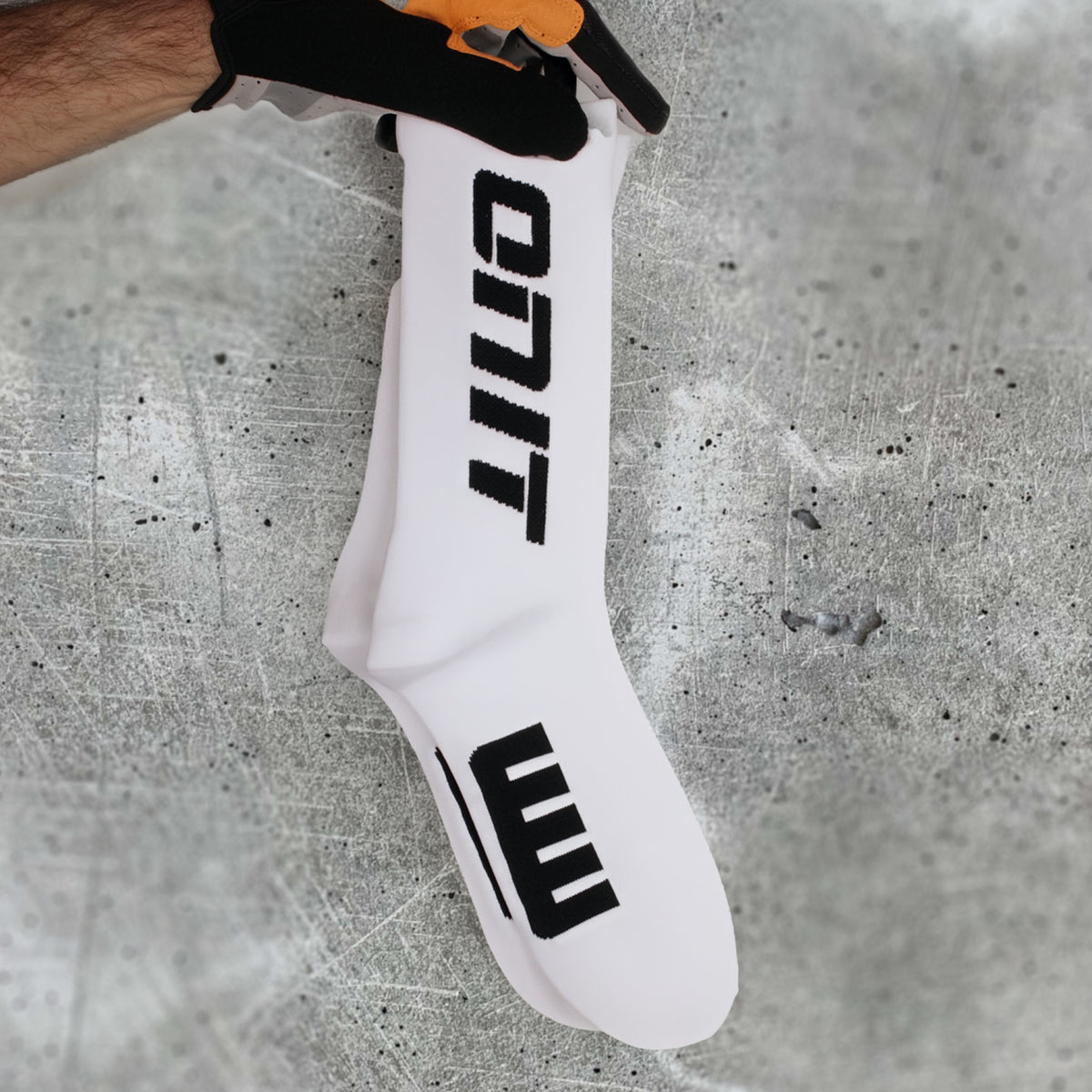 ONIT White compression MTB socks, worn on foot